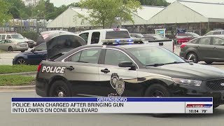Man arrested in Greensboro after bringing gun into Lowe's on Cone Boulevard, police say