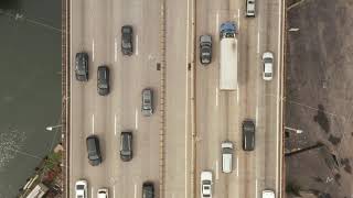AERIAL: Birds Eye View of Highway with busy car traffic on Grey day New York City