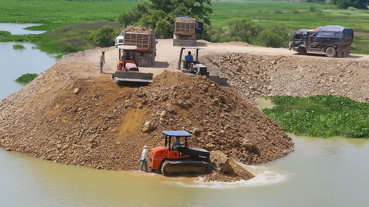 Amazing Both Komatsu Bulldozer Draining filling leveling Dump Truck does it all on site repair