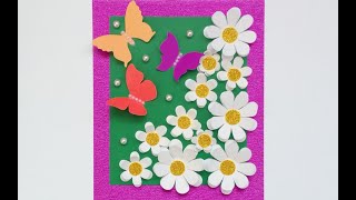 Аpplication with daisies made of colored paper#