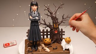 Halloween Pumpkin Dryad and Addams Wednesday made of polymer clay.