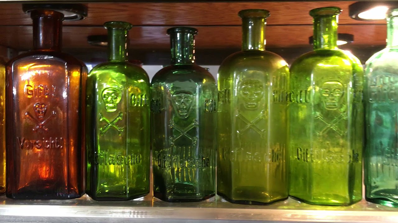 Antique Skull & Cross Bones poison bottle collection 