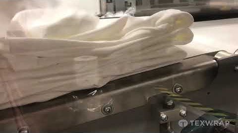 Texwrap CSS 2011 Continuous Motion Side Sealer Stacking & Shrink Wrapping Folded Shirts | ProPac.com