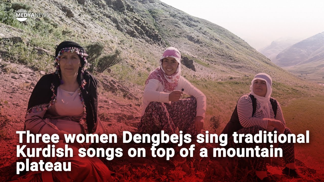 Three women Dengbejs sing traditional Kurdish songs on top of a mountain plateau