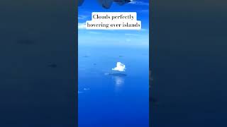 Clouds perfectly hovering over islands