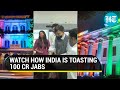 India lights up to celebrate 100 crore Covid jabs, Mansukh Mandaviya distributes sweets