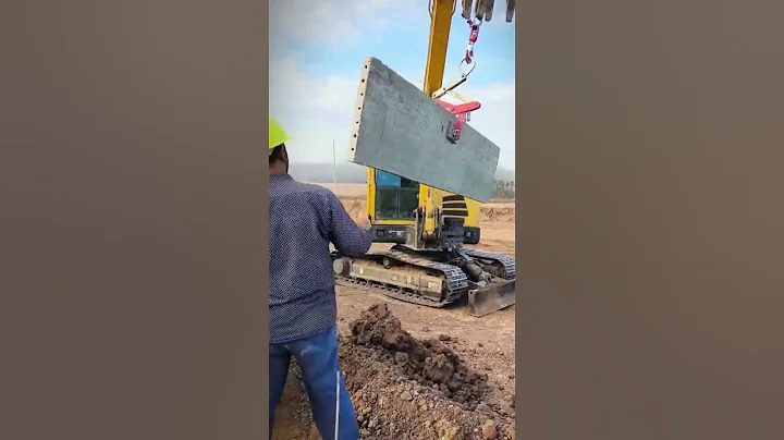 installation of concrete fence by transporting it with an excavator #shorts