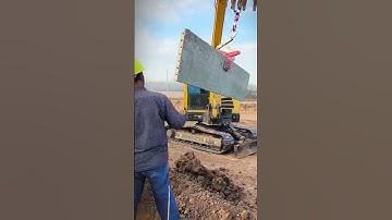 installation of concrete fence by transporting it with an excavator #shorts