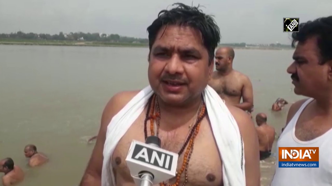 Devotees take holy dip in Ganga after solar eclipse