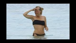 Gillian Anderson, 56, looks sensational as she showcases toned midriff in a black bikini during Mexi