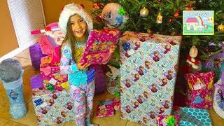 Hailey opens huge surprise toys presents on Christmas Morning like a Disney Princess Powerwheels Ride-On Toy Car, Frozen 