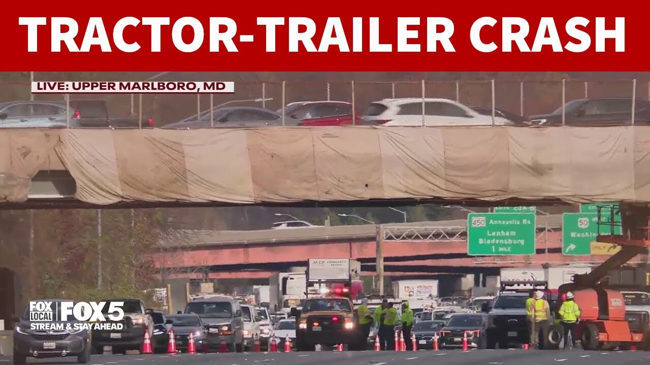 Massive delays after tractor-trailer strikes overpass on I-495