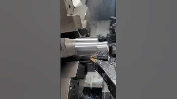 CNC Lathe in Action: Real Machining Process with Metal Chips Flying