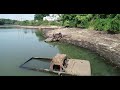 Cars found underwater as pond is drained