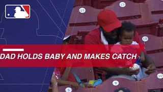 Fan makes the barehanded grab while wearing baby