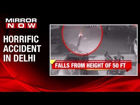 Delhi woman on bike thrown off flyover, survives 50 feet fall | Caught on camera