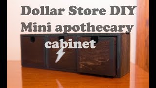 Dollar Store DIY Craft - Mini Apothecary Cabinet So I found this small cabinet desk thing at the Dollar store. So I decided to make into a small apothecary cabinet. Consider