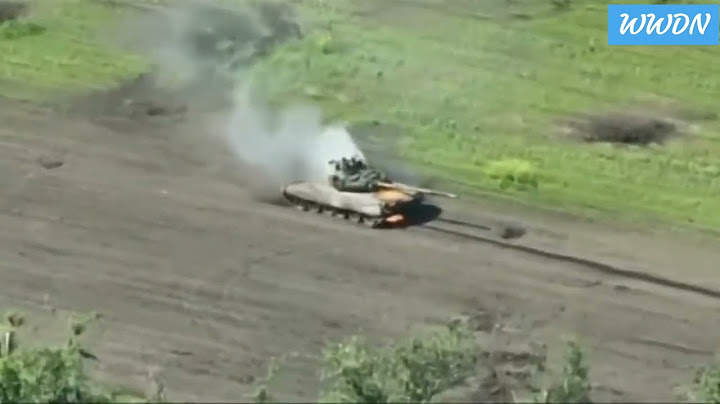 Russian troops fleeing after their T-80 tank was hit by Ukrainian artillery
