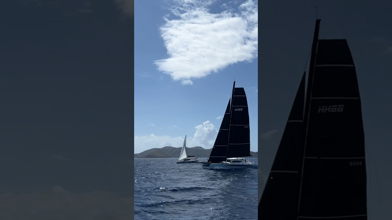 HH66 Catamaran flying a hull passing a Leopard 45 #sailing #hhcatamaran #catamaran #sailingfamily