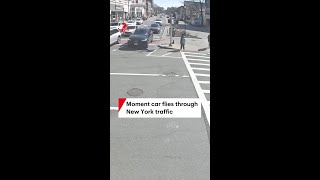 Moment car flies through New York traffic