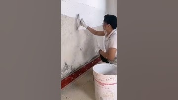 the process of leveling the cement mixture on the wall #shorts