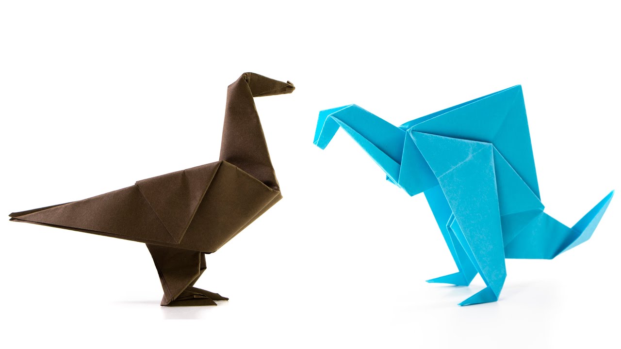 Dinosaurio vs. pájaro de papel. Idea de origami.