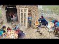 Preparing breakfast on a rainy day by a village woman