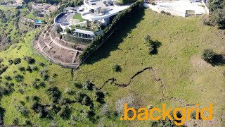 Huge crack in the hillside next to Travis Scott’s $23.5million mansion in Los Angeles, CA