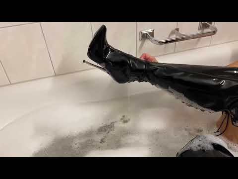 Barefoot with leather boots in the bathtub. Look at my feet.