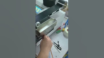 HH-345F Tape Spot Wrapping Machine is doing 60mm PVC tape wrapping on cable assembly