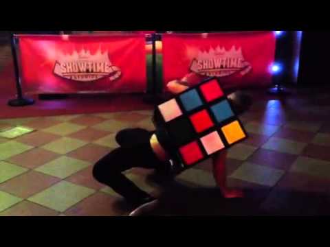 Gary Barlow dancing as Rubik's Cube