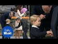 Prince George rejects a high five but accepts handshake