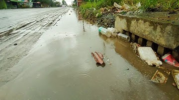 Unclogging Culvert Pipe Drainage - Removal Plastic And Trash Clog Culvert Pipe Drain After Rain