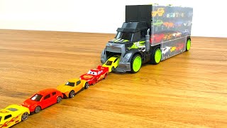 29 type Tomica Cars sliding down from big black truck Transporter