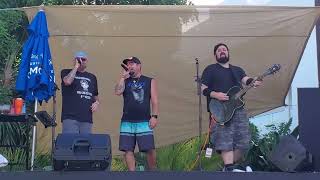 Joe Bachman, Chris Kirkpatrick and Zack performing at Pop2000 in Paradise