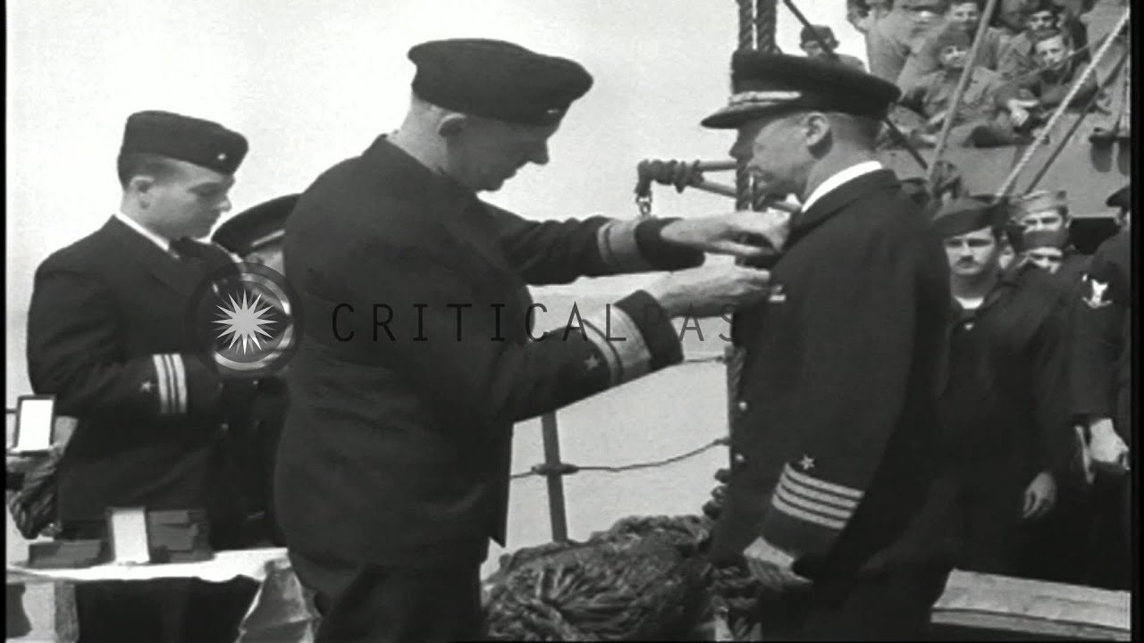 Admiral Rockwell present citation to American sailors and Naval