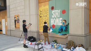 Boarded up storefront becomes canvas for street artists | More in Common