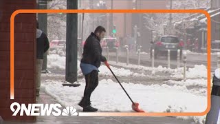 Wet, heavy snow falls into the Denver metro area