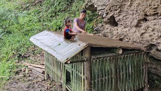 Girl building bamboo and mud chicken coop - single mother