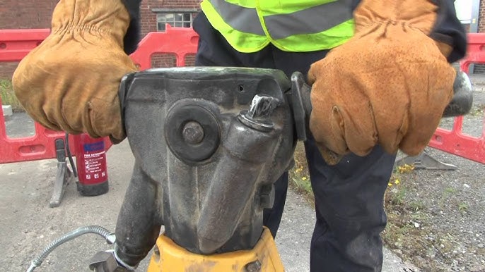 Jack Hammering Concrete With High Powered Air Jack Hammer 