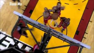 Derrick Rose drives over LeBron and D-Wade