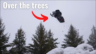 Dude Evan bro launches a snowmobile over the trees
