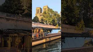 Magic golden light by the river Seine, just in front of the Cathedral Notre Dame.