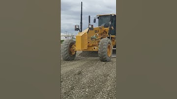 HEAVY MACHINE motor Grader spreading gravel at construction(2)