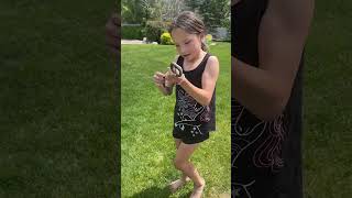 Fearless Girl Grabs A Garden Snake Out Of The Bushes