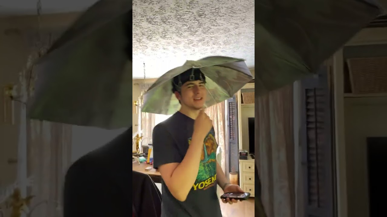 My guy bought a umbrella hat ￼