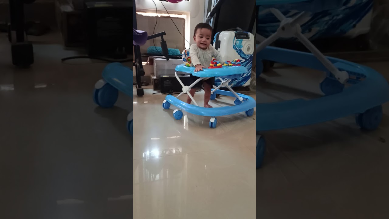 Baby walking in Walker for the first time - YouTube