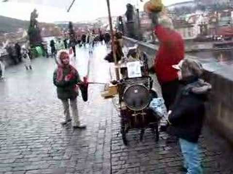 hand organ player on Charles Bridge in prague