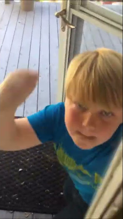 Spoiled kid breaks window then cries