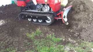 Mini Dozer, Crawler pushing Dirt, Caterpillar